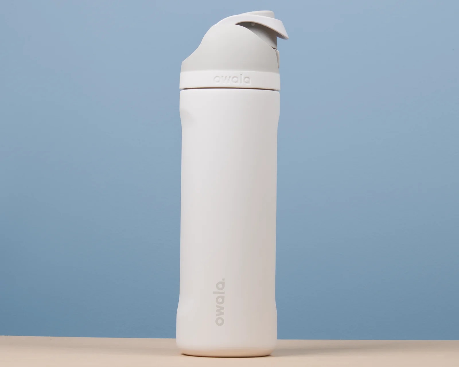 Front view of the Owala FreeSip 24 oz stainless-steel bottle in Shy Marshmallow
