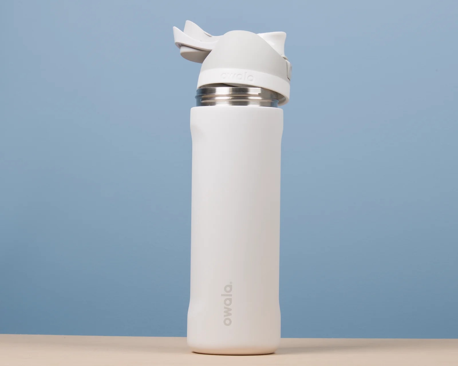 Owala FreeSip 24 oz bottle in Shy Marshmallow, lid open
