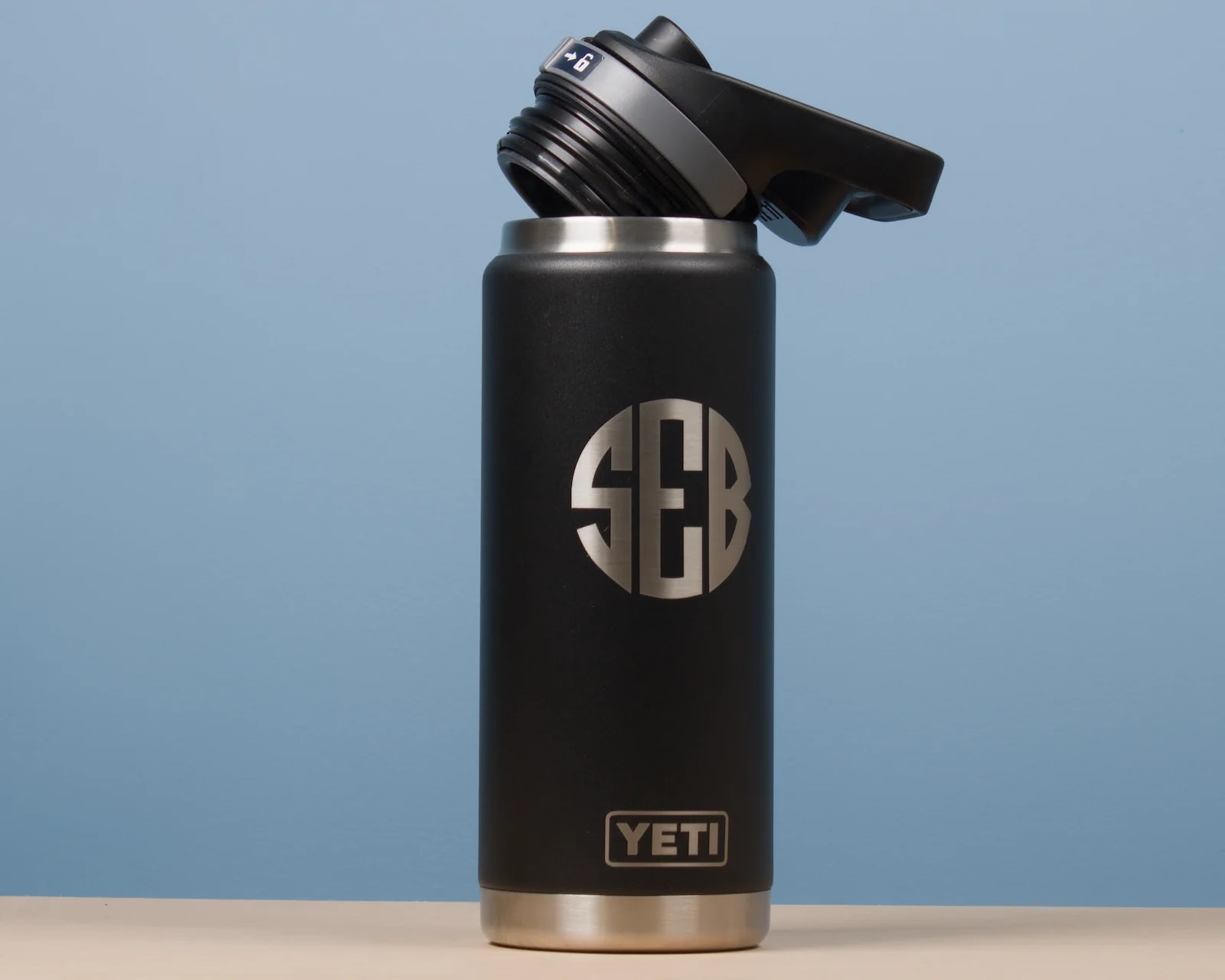 Black YETI Rambler 26 oz (769 ml) bottle with its Chug Cap open