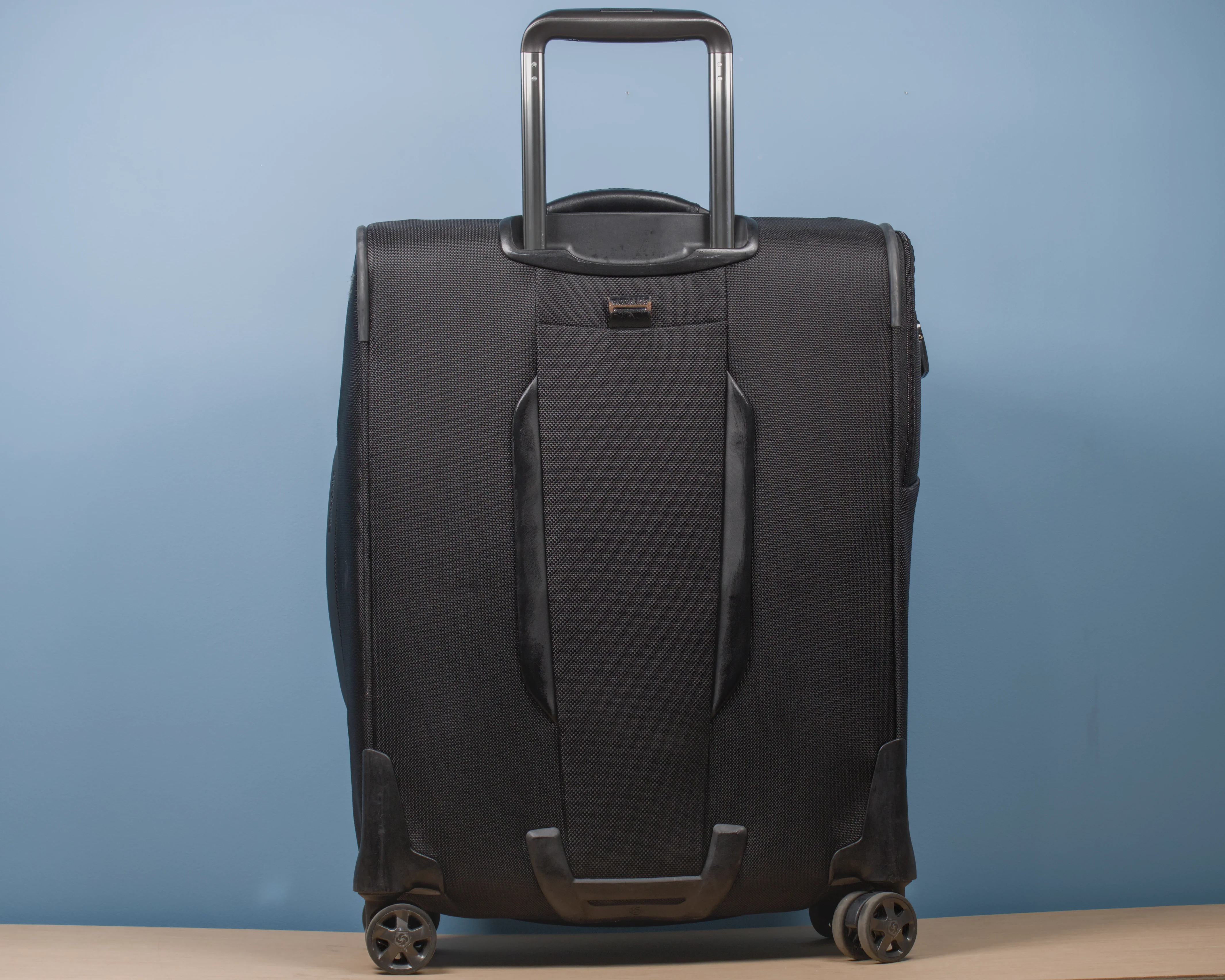 Full rear view of the Samsonite Pro-DLX 5 Spinner S black cabin suitcase